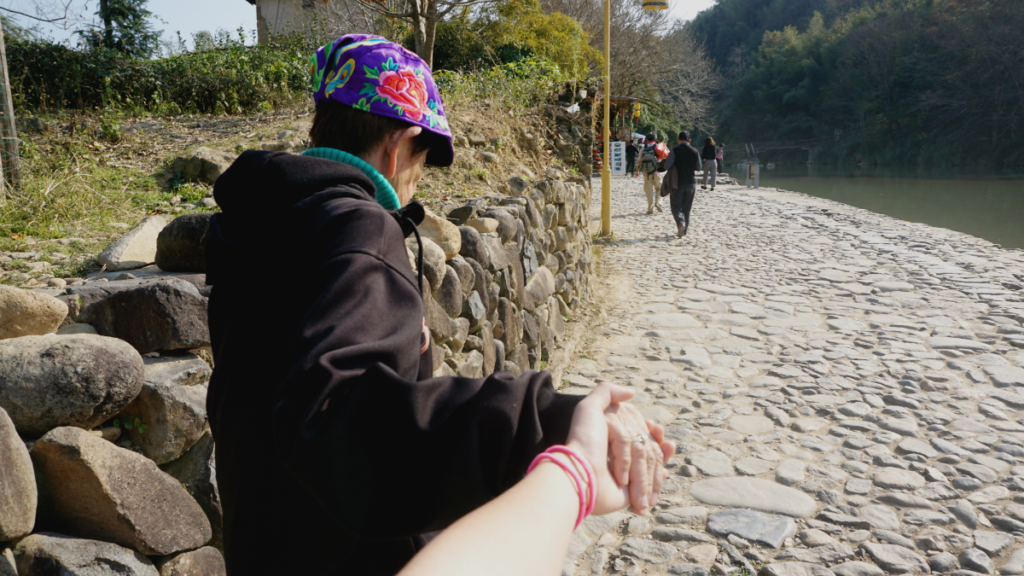 Holding my grandma's hand to make sure she doesn't get lost as we went sightseeing in China 
